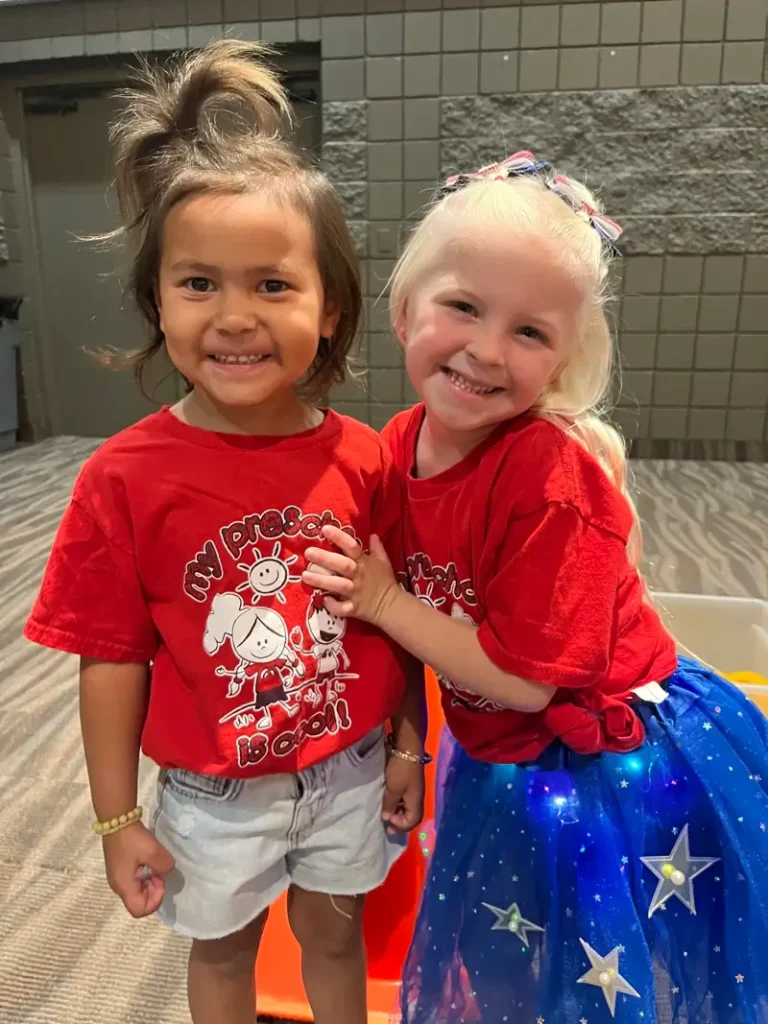 Girls wearing La Casa Preschool t-shirts